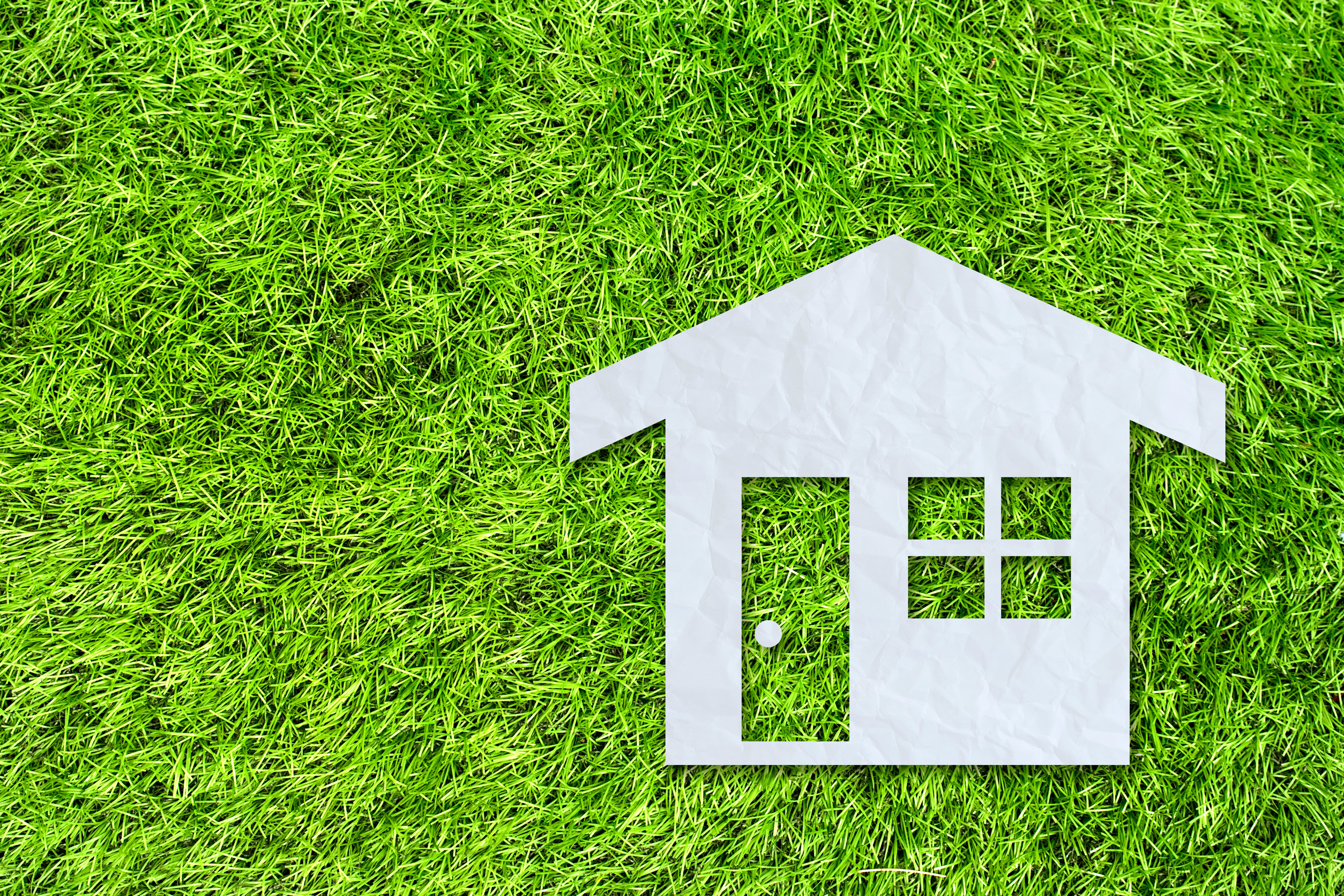 HOA-compliant artificial turf installation in a Tucson neighborhood with desert landscaping